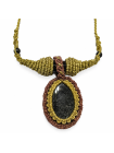 Detalle del doble engarce con obsidiana dorada y ojo de tigre